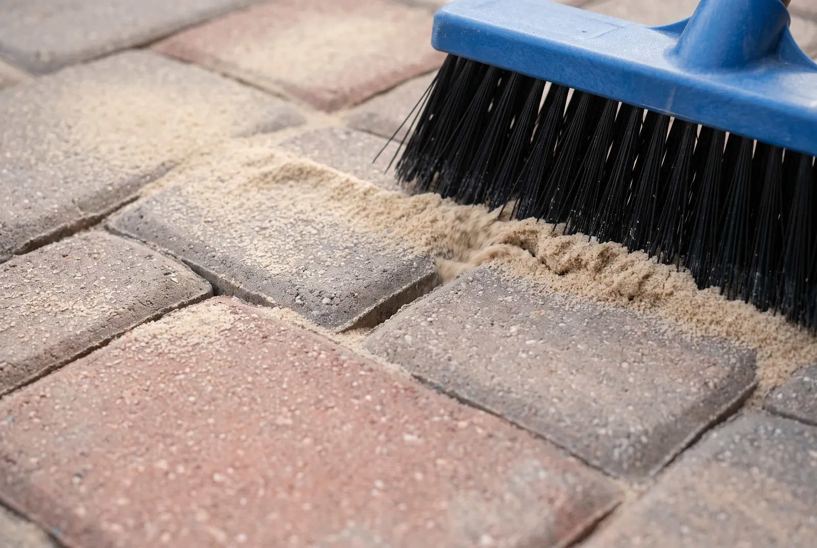 Paver sealing in Tampa Bay: joint sand swept into the gaps between concrete pavers