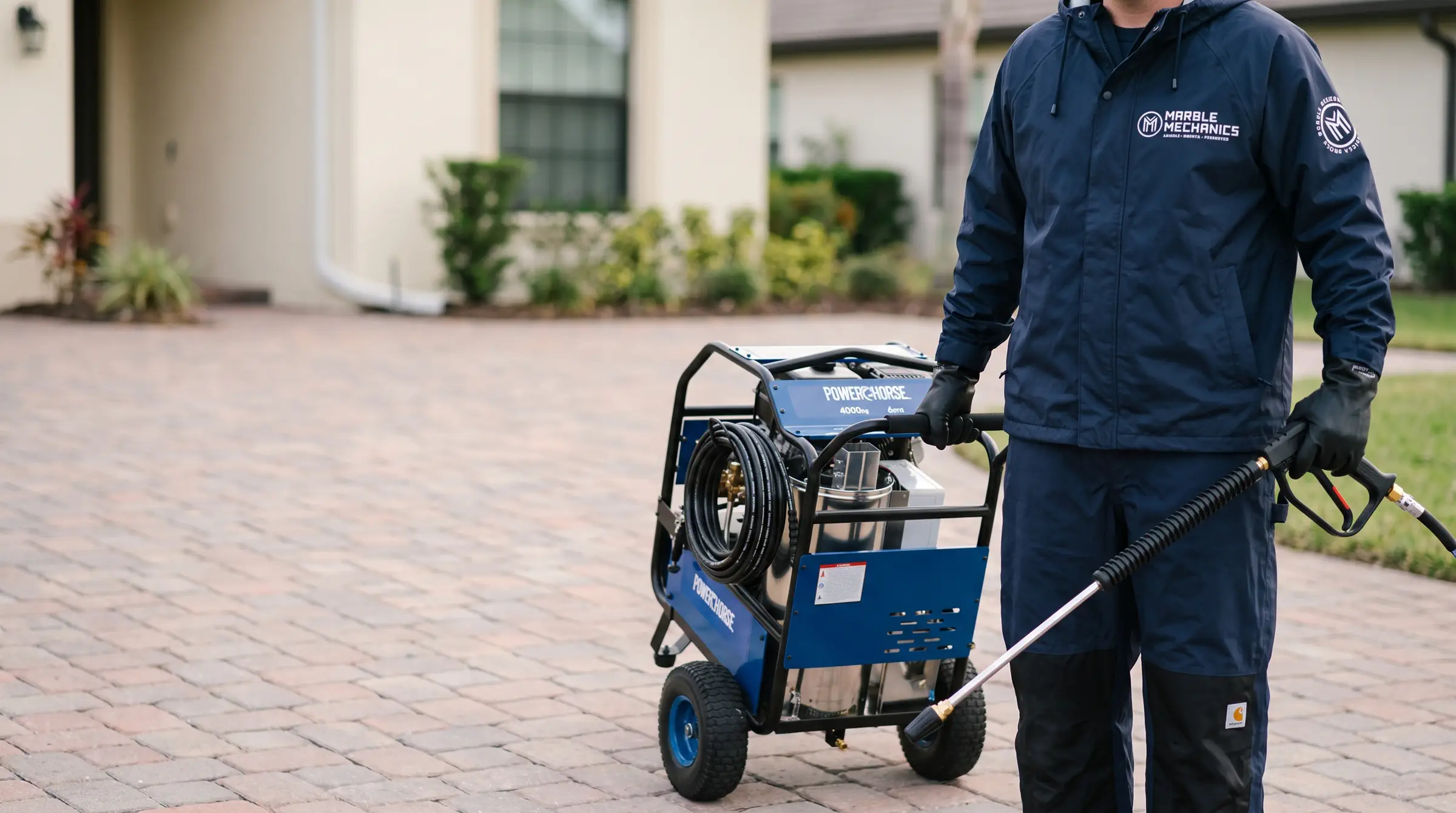 Paver sealing in Tampa Bay: a Marble Mechanics pressure washing rig on a paver driveway